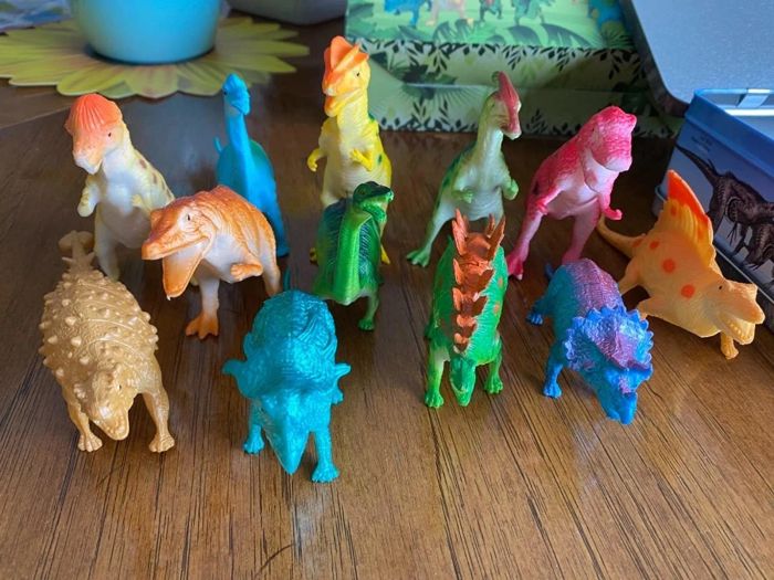 A close-up reviewer's photo of the dinosaur toys