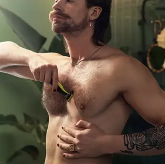 A man shaving his face completely