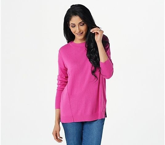 a model rocking the sweater in a vibrant shade of pink