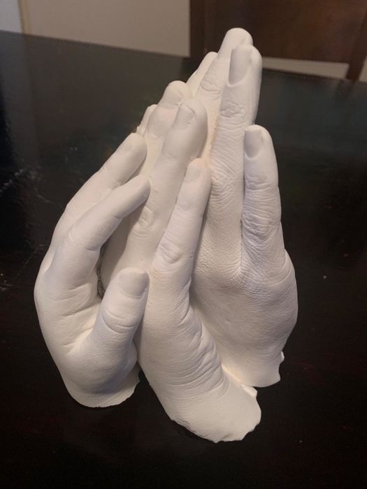 Photo of three hand casts from a reviewer