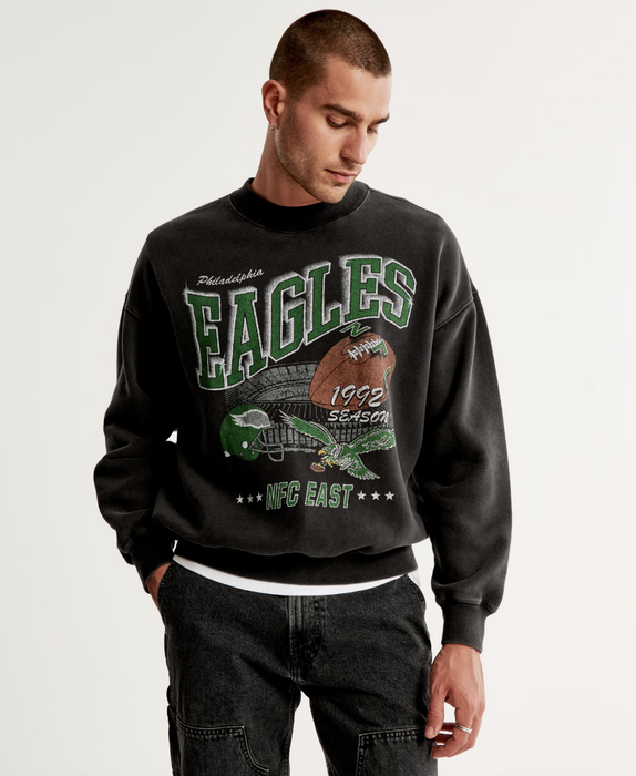 A man sporting a vintage Eagles crewneck