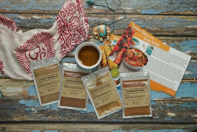 Spice packets arranged with recipe cards for easy reference