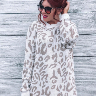 another reviewer wearing the same sweater in white