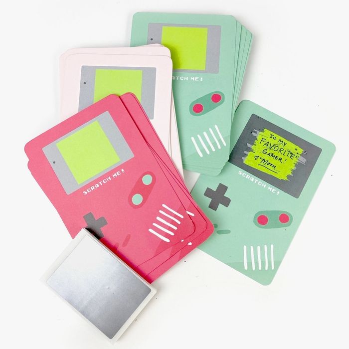 A collection of scratch-off cards designed to resemble Gameboy systems
