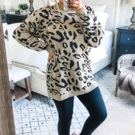 a reviewer rocking the tan and black leopard print sweater with leggings
