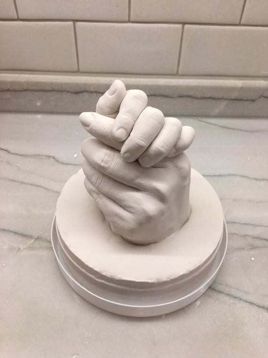 Another reviewer’s photo showing two hands interlocking in a display of unity