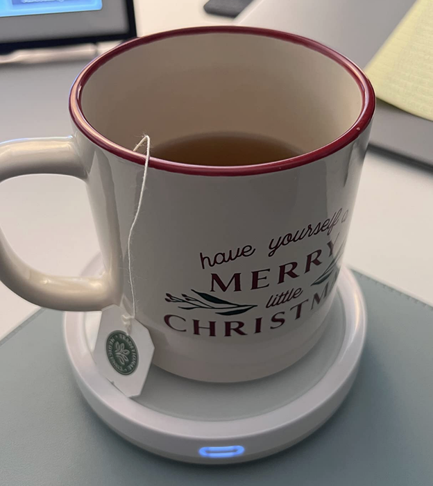 A close-up of someone's tea mug sitting on their desk