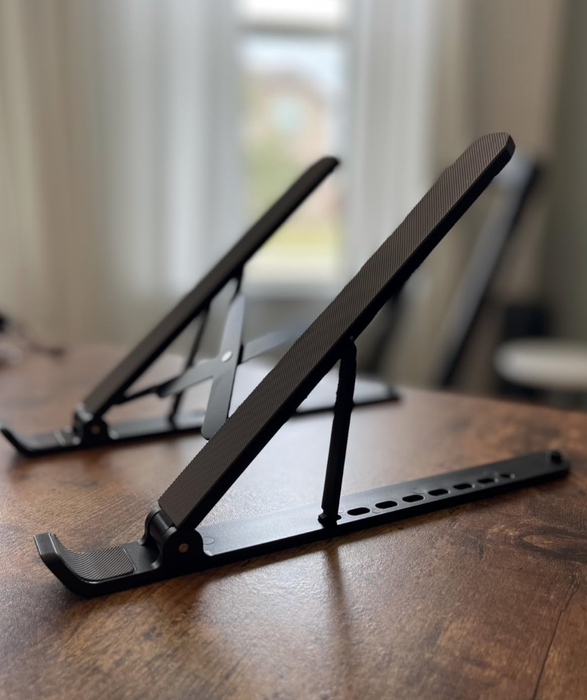 A close-up of a laptop stand set up on a desk