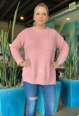 another reviewer styled in the sweater in pink