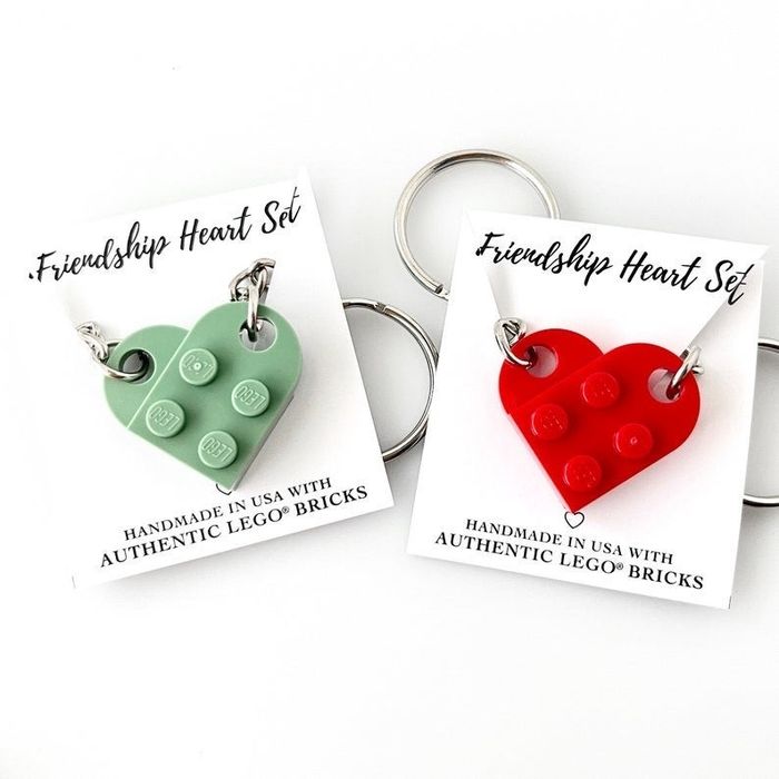 Two heart-shaped keychains in green and red
