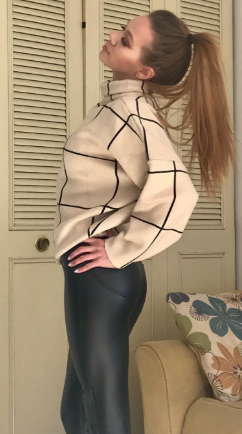 a reviewer styling the sweater