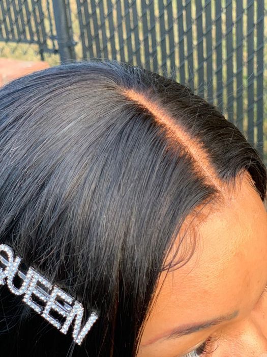 A close-up shot of the reviewer’s glued-down wig.
