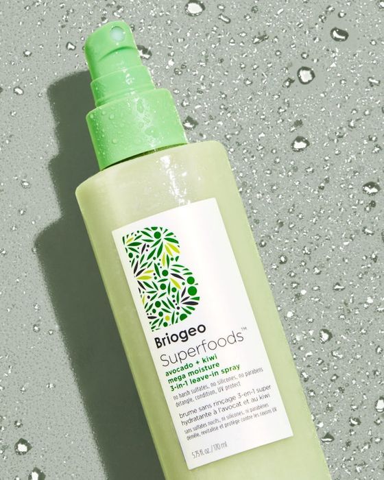 The green bottle of leave-in hair treatment.