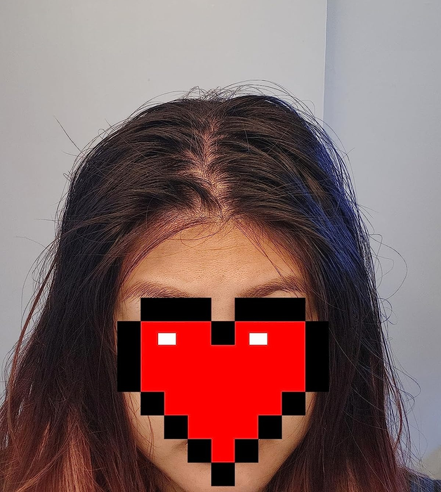 A before image of a reviewer with frizzy, unclean hair.