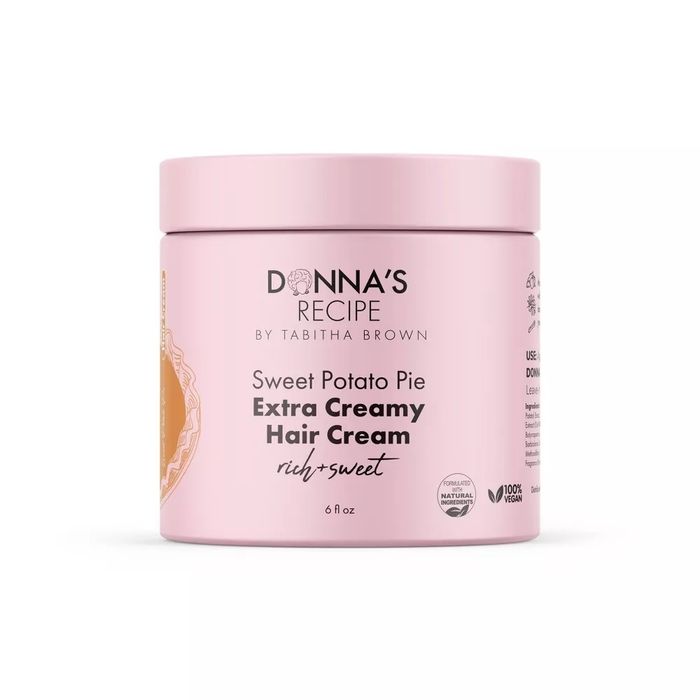 Donna's Recipe by Tabitha Brown Sweet Potato Pie Extra Creamy Hair Cream jar, labeled as rich and sweet. Featured in a shopping article.