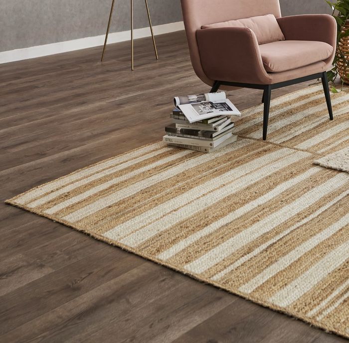 The runner with tan and white stripes, adding a touch of style to any space.