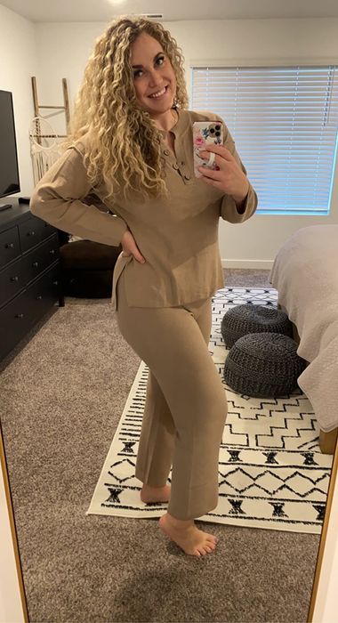 A reviewer wearing their beige lounge set