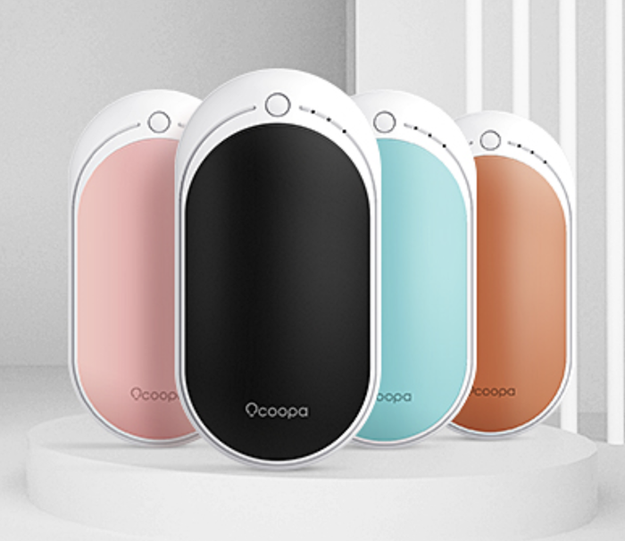 The oval-shaped hand warmers come in pink, black, blue, and orange, each featuring a button on top to control the heat settings.