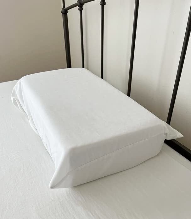 The Pillow Cube resting on a reviewer's bed