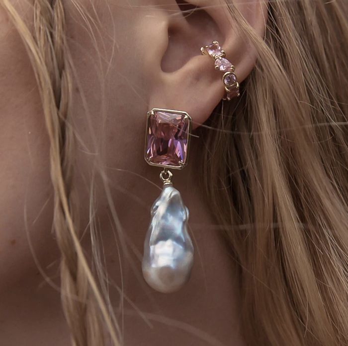 A model showcasing the earrings