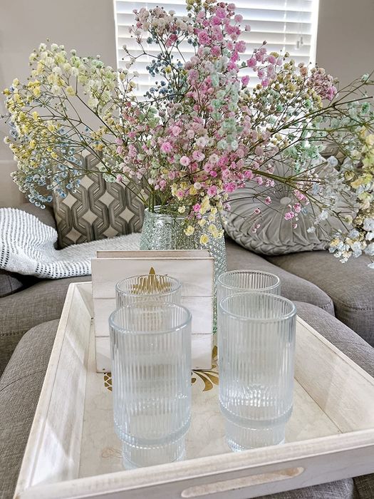 The same reviewer’s set of elegant glasses neatly arranged on a tray.