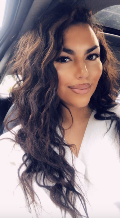 A reviewer displaying their wavy hair.