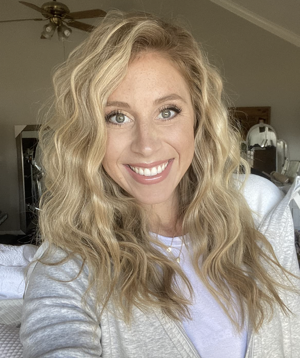 A reviewer showing off their wavy hairstyle.