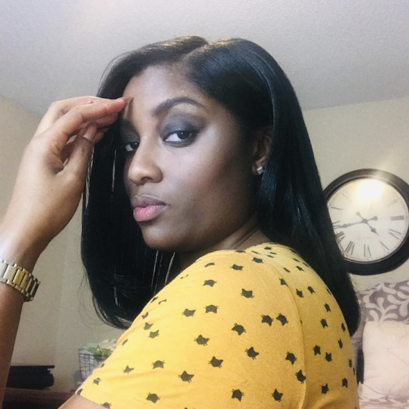 The same woman with her hair styled straight using a flat iron.