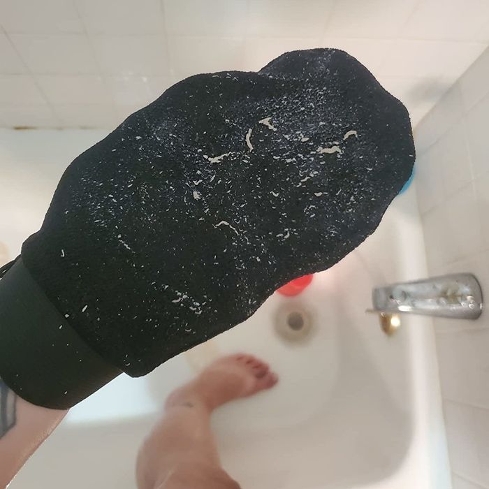A photo from a reviewer showing the mitt covered in dead skin.