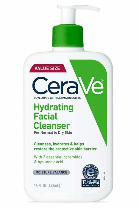The green and white bottle of the cleanser.