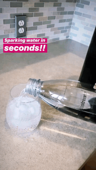 A gif of a Mytourer pouring water into a glass, with the words displayed