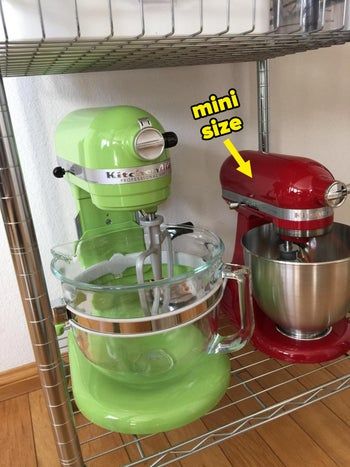 A reviewer's large green mixer next to their compact red mini mixer