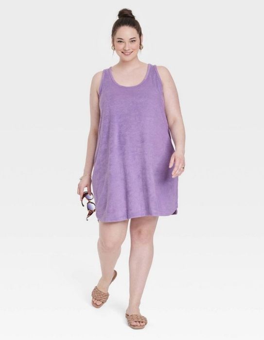 A model wearing a vibrant purple tank dress.