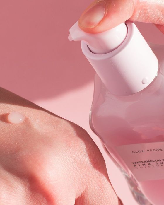 A model applying the moisturizer to the back of their hand