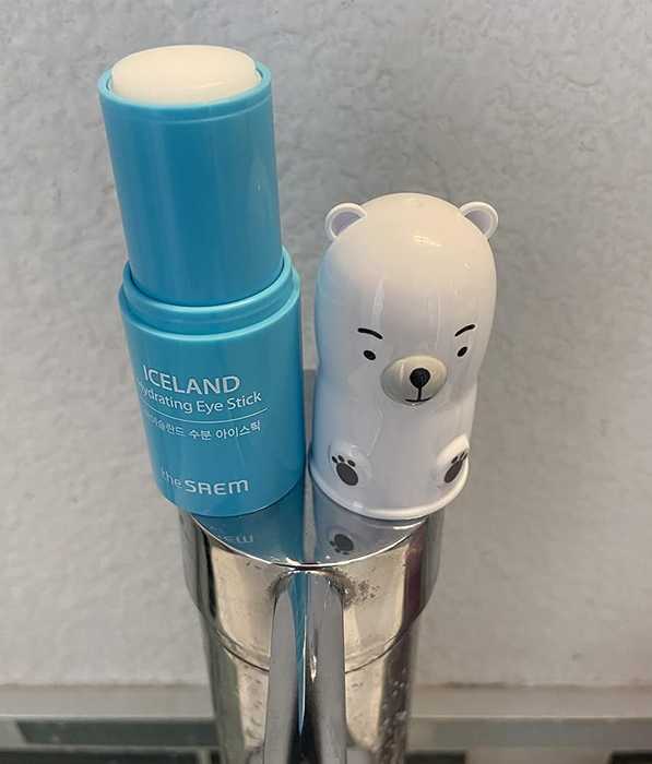 Another reviewer showing the polar bear-shaped product with the cap removed from the stick
