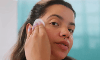 A model applying the pads to their freshly cleansed face