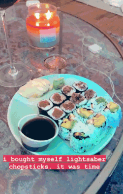 Mytour editor using the blue, glowing chopsticks to eat a piece of sushi