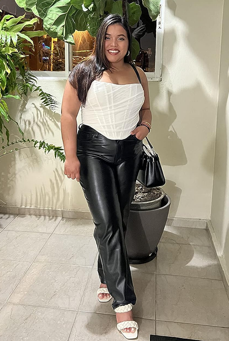 A reviewer is seen wearing the strapless version of the bustier top in white.