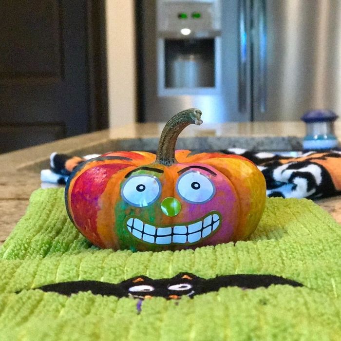 a reviewer’s photo of a pumpkin painted using the tempera paint sticks