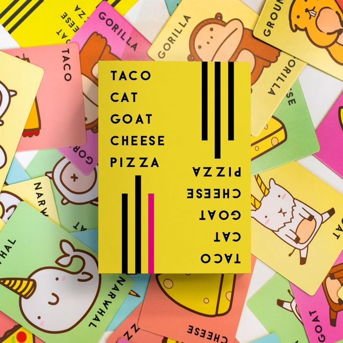 A box filled with the game cards for Taco Cat Goat Cheese Pizza