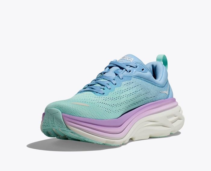 The sneakers come in a mix of teal, blue, and purple shades.