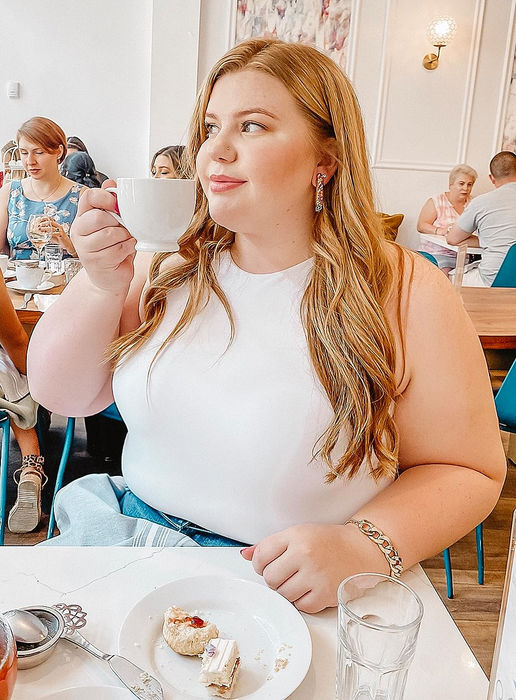 Reviewer in the white halter tank top