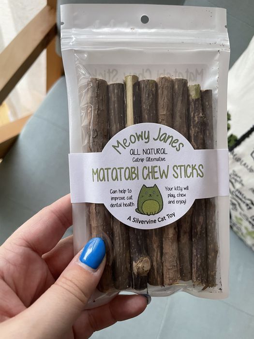 A Mytour editor showing off the Meowy Jane chew sticks.