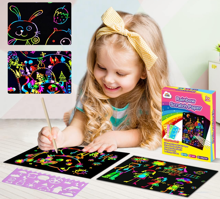 A child using a stencil to draw on the scratch paper with the rest of the supplies nearby