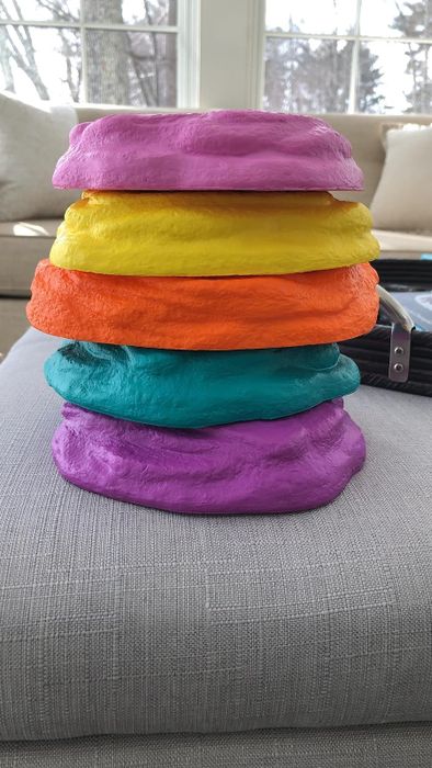 A pile of vibrant stone-shaped toys