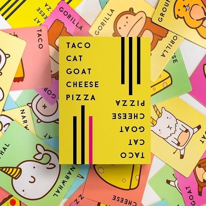 A box for the Taco Cat Goat Cheese Pizza card game, surrounded by illustrated cards featuring various animals and objects
