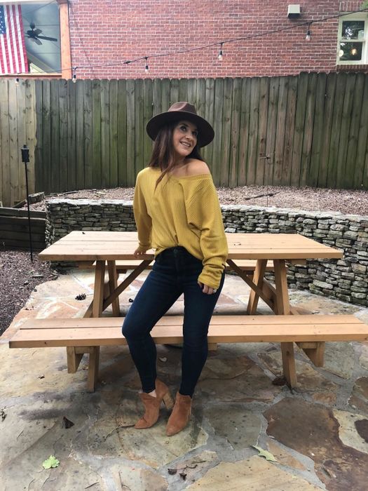 Another reviewer rocking the same off-the-shoulder sweater in a bright, eye-catching yellow.