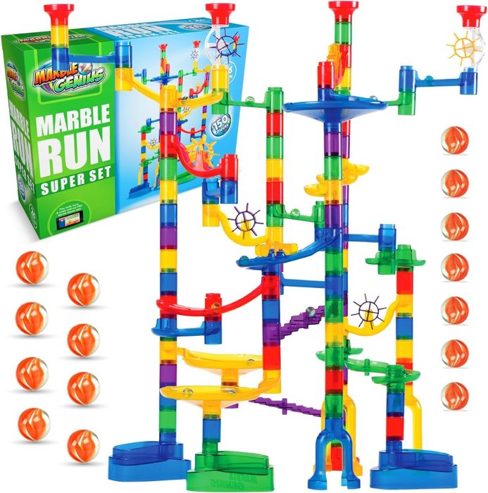 A marble run toy set featuring colorful tracks and multiple orange marbles, placed alongside the packaging box, encouraging imaginative play