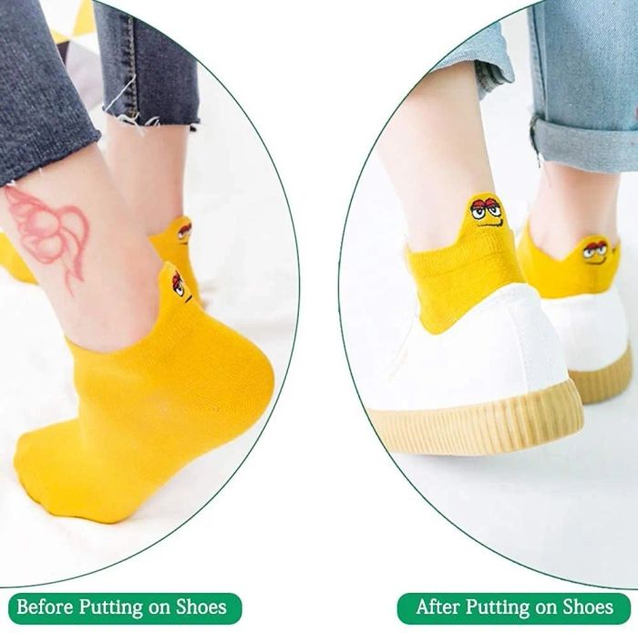 Socks featuring back tabs with fun, muppet-inspired faces that add a quirky touch to their look.