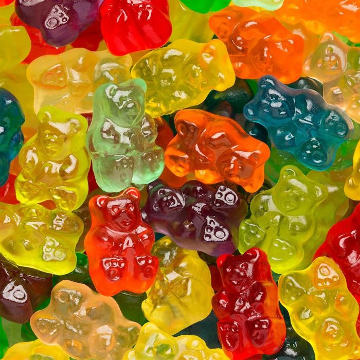 A bunch of colorful gummy bears in a pile, waiting to be devoured.